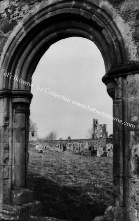 MELLIFONT ABBEY GATE TOWER SEEN THROUGH N.E. ARCH OF LAVABO